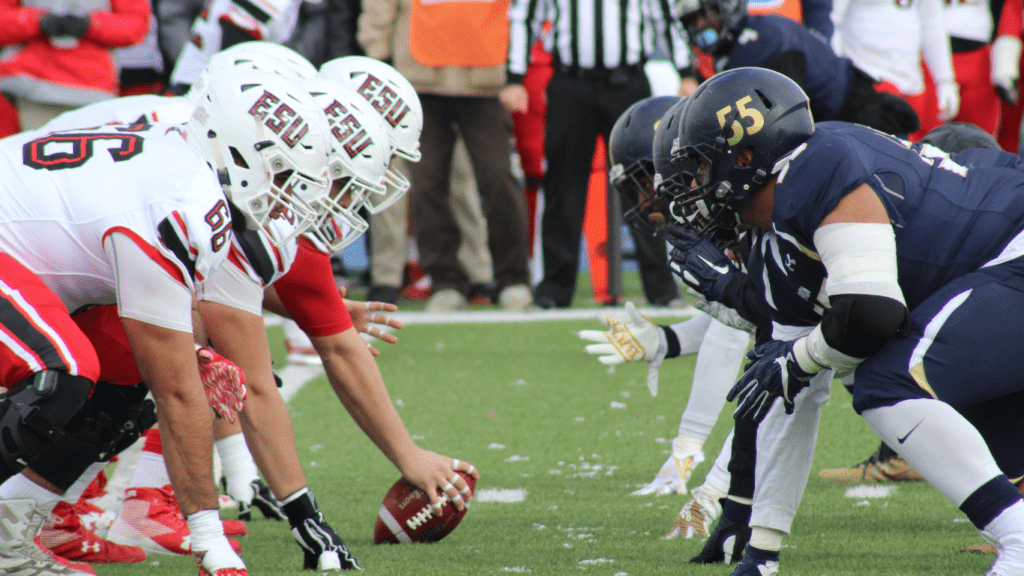 a group of football player in the field