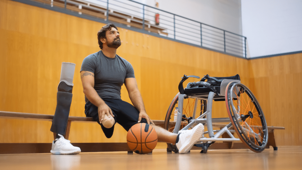 a person in a wheelchair sitting next to a basketball ball