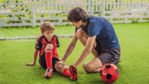 soccer player laying on the ground