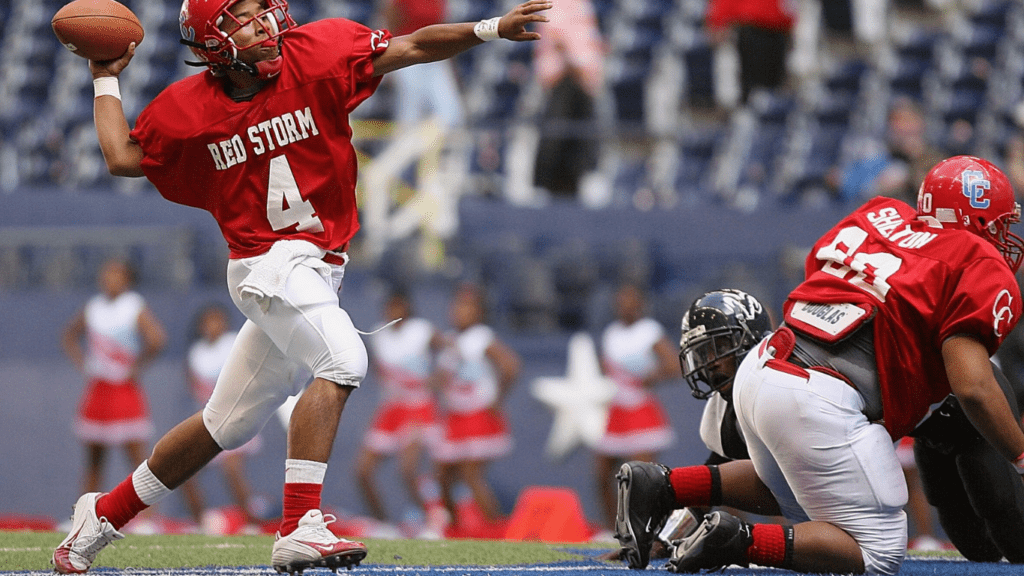 a football player throwing the ball during a game