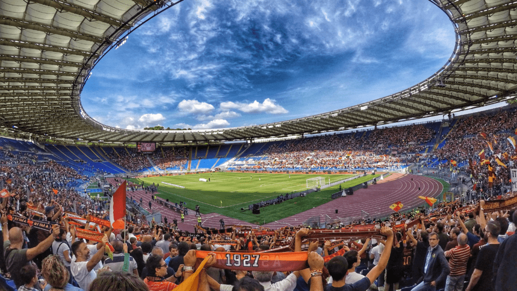 fans at a soccer game in an open stadium