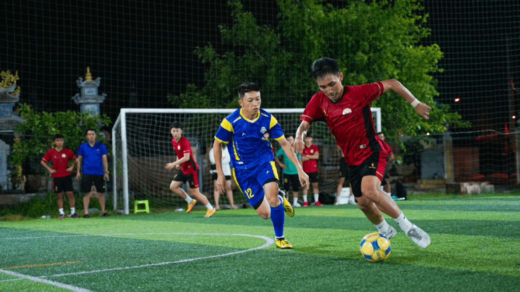 two people playing soccer on a field