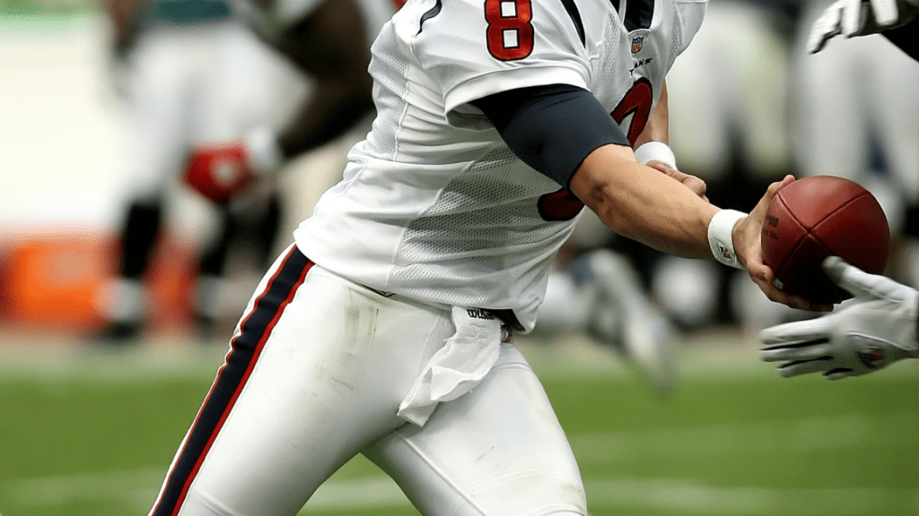 a football player holding football ball