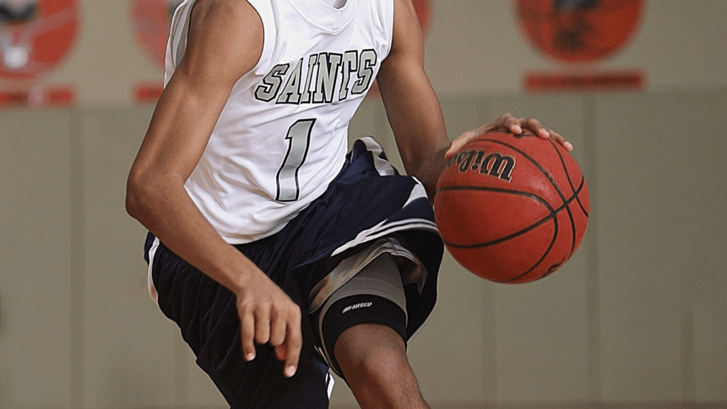 a person holding a basketball ball