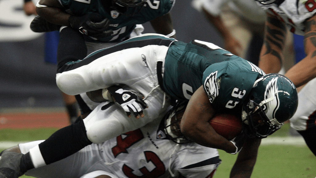 a philadelphia eagles football player is tackled by another player