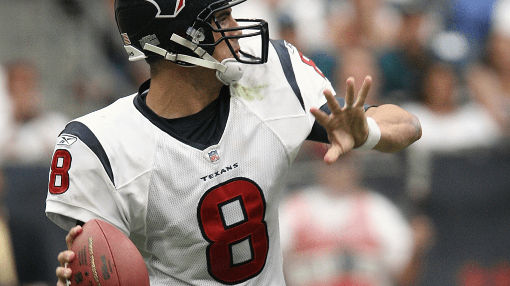 a football player holding football ball