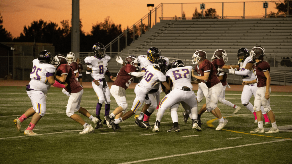 a group of football player in the field