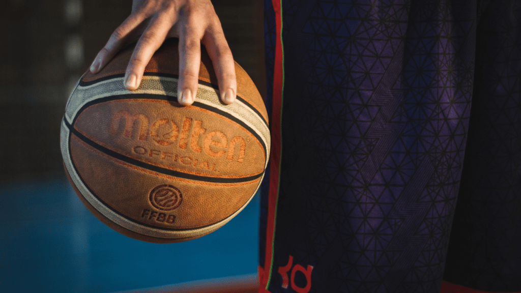 a person holding a basketball ball