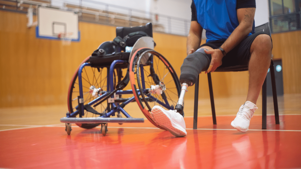 a person in a wheelchair sitting next to a basketball ball