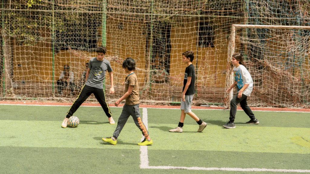 an aerial view of soccer players on the field