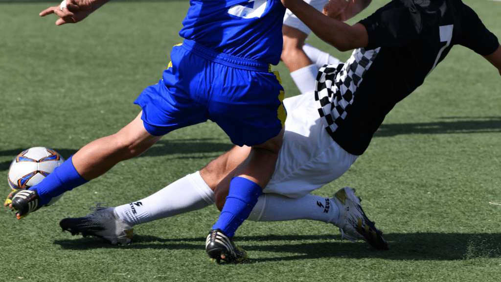 soccer players in action on a soccer field